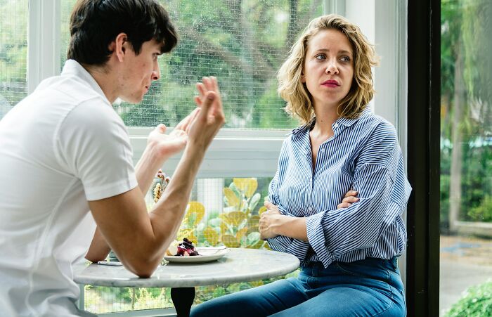 Couple having tense conversation showing clever insults in relationship context