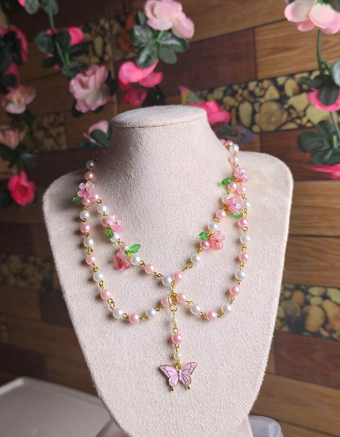 Handmade pink floral pearl necklace with butterfly charm quirky jewelry