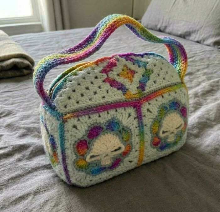 Handmade crochet purse with rainbow skull designs and handle