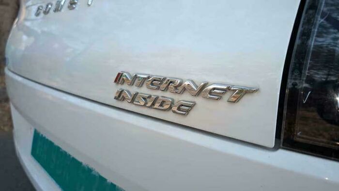 A car with the words 'INTERNET INSIDE' as a design fail, indicating a hilariously unhinged concept.