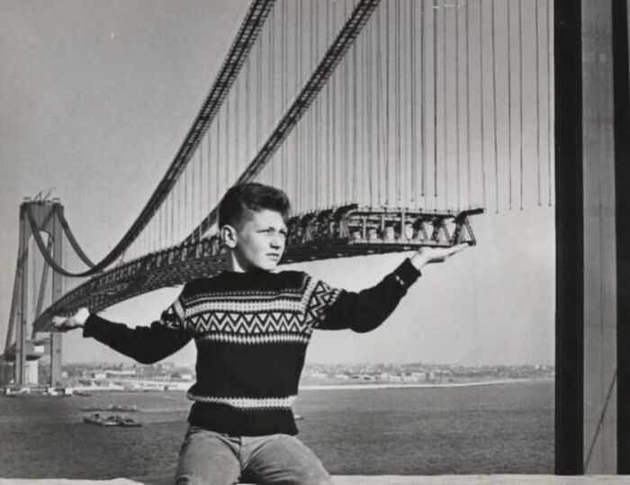 Child Poses In Front Of The Verrazzano-Narrows Bridge During Its Construction, Cir. 1963