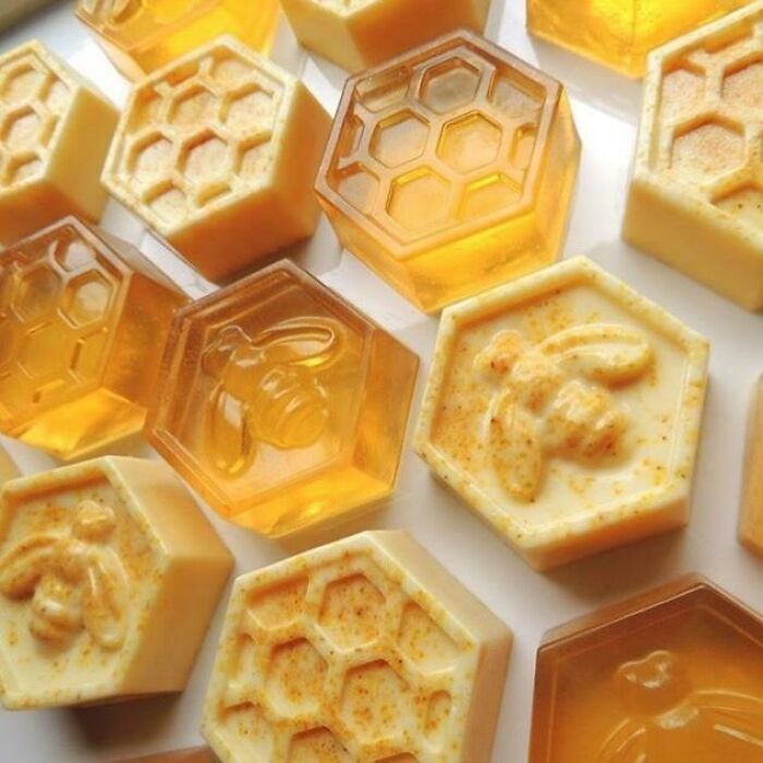 Hexagonal honeycombs with bee shapes, resembling soap or forbidden foods.