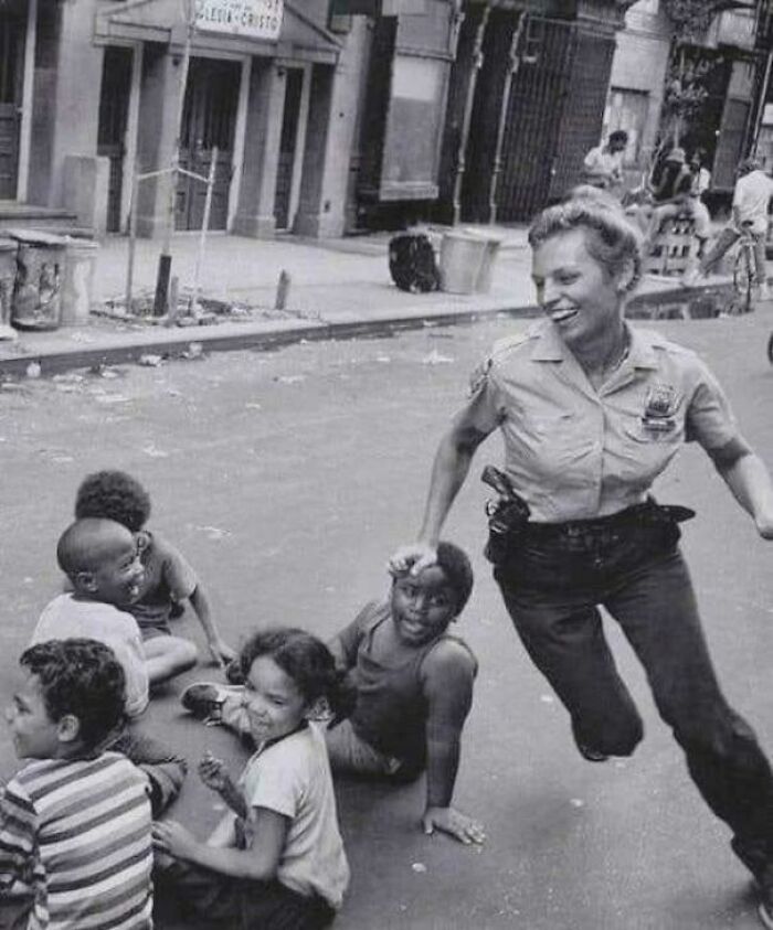 Nypd Policewoman Playing Duck, Duck, Goose, 1970s