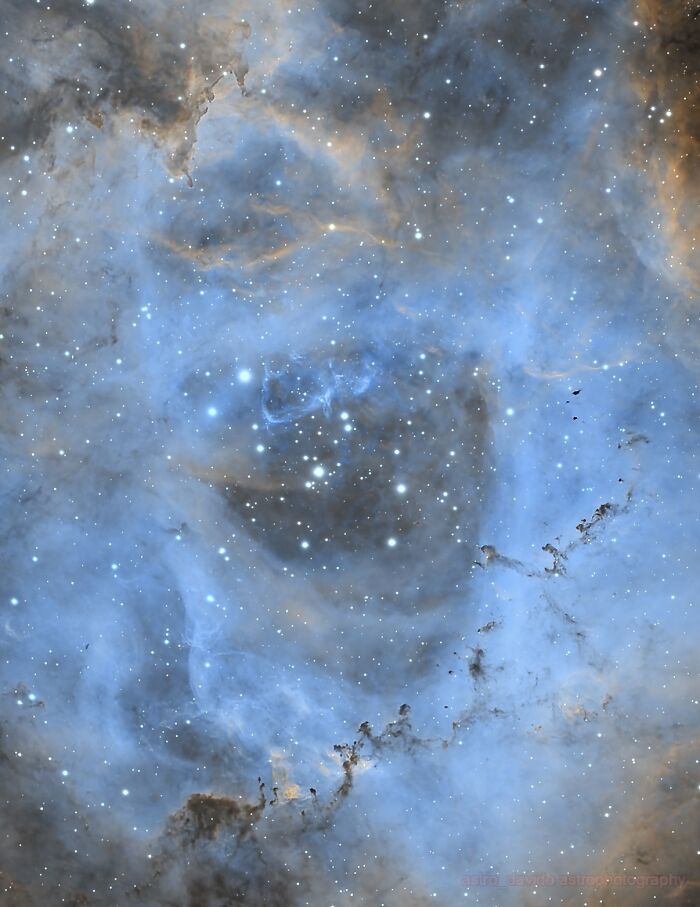 Astrophotography of a blue and orange nebula with bright stars in Kentucky backyard