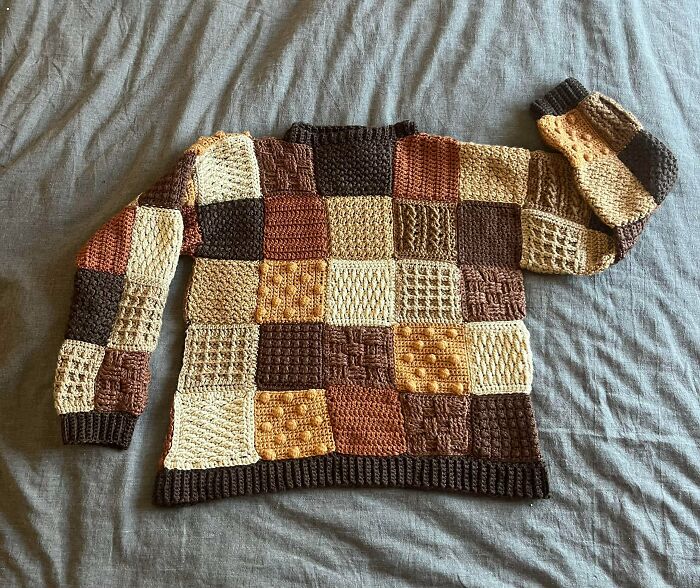 Patchwork crochet sweater with various brown and beige textured squares