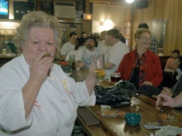 Staten Island Chef Puffs A Cigar While Holding A Beer In March 2003, A Night Before The NYC Smoking Ban Went Into Effect