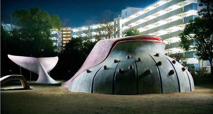Surreal Japanese playgrounds at night, resembling abstract sculptures, illuminated against a cityscape, by Fujio Kito.