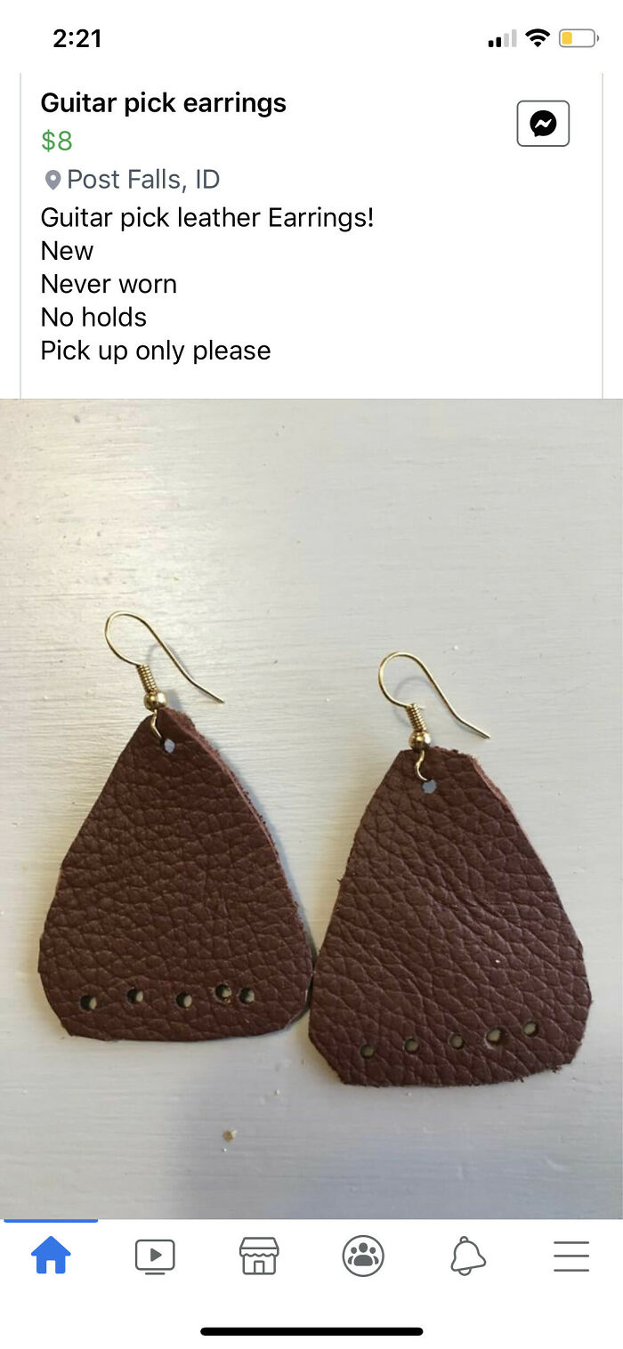 Brown leather guitar pick earrings, a DIY fail from someone whose confidence outpaced their skills.