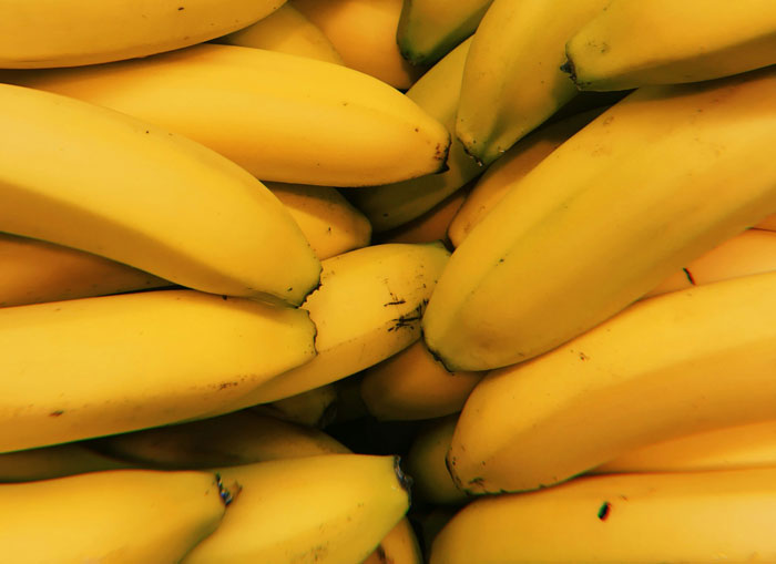 Close-up of ripe yellow bananas piled together