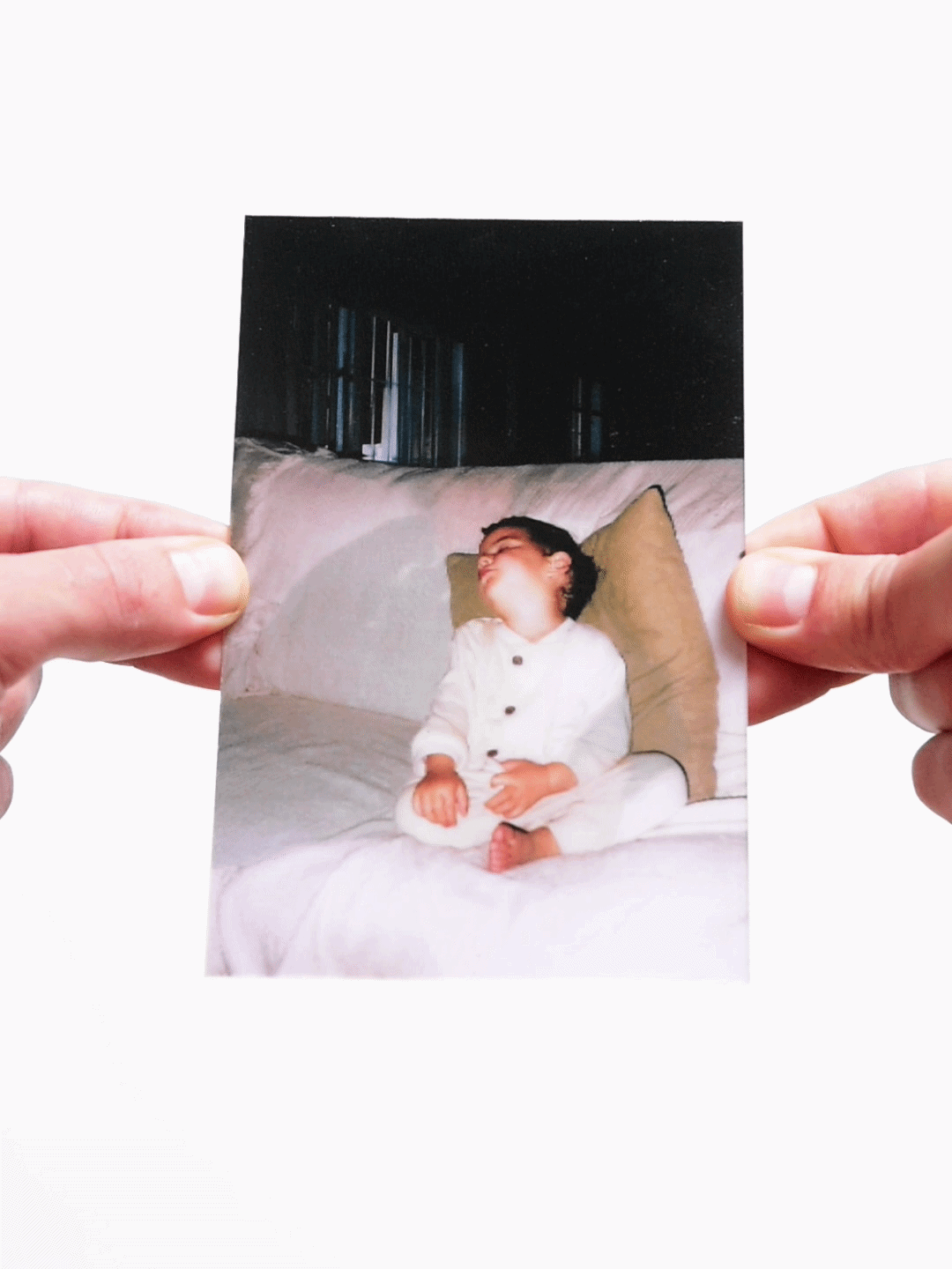 Child sleeping on couch in childhood photo with d**d father removed