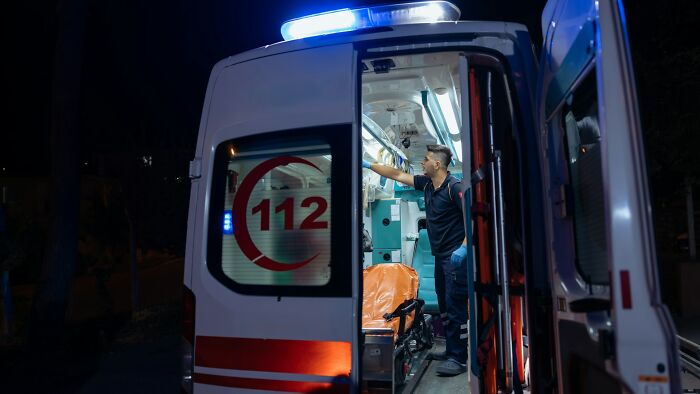 Emergency services attend to an incident, reflecting unhinged situations cabin crew might deal with.