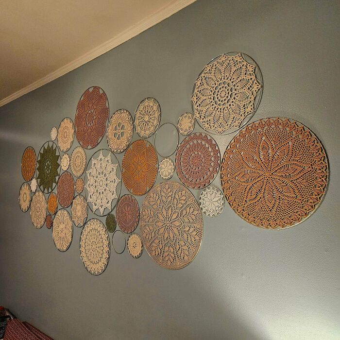 Collection of round crocheted wall hangings in various colors