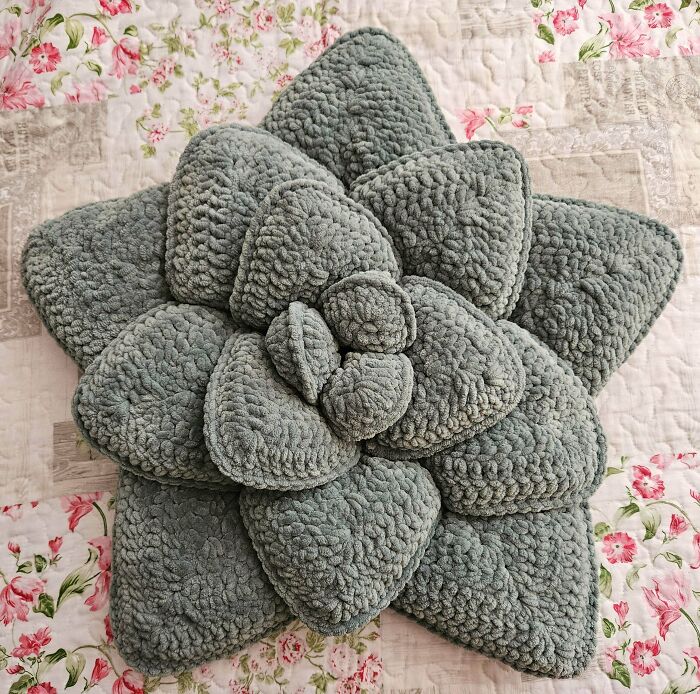 Gray crocheted succulent pillow with layered petals