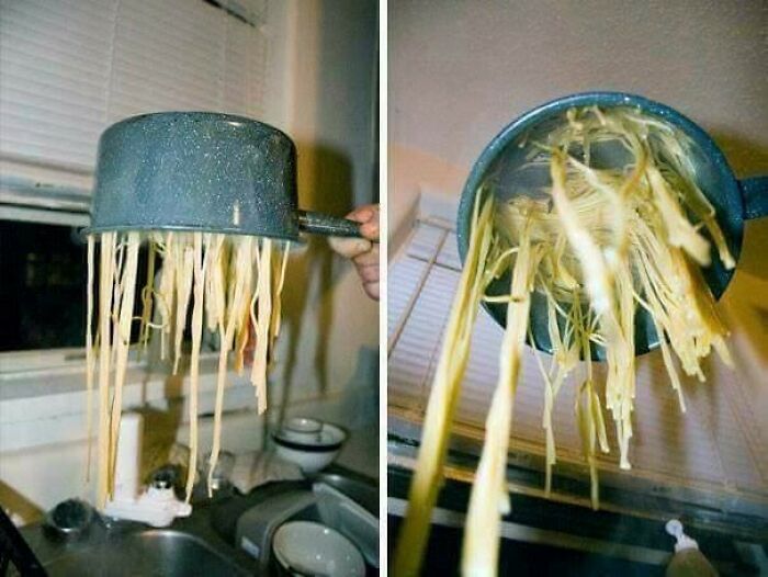 A person holding a pot of spaghetti upside down over a sink, showing a big kitchen fail.