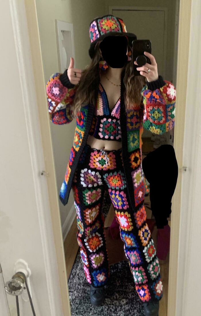 Colorful crocheted outfit with jacket, pants, and hat in granny square pattern