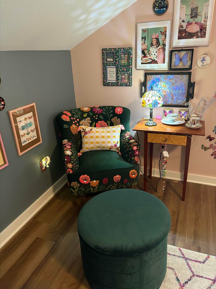 Cozy reading nook with floral armchair and green ottoman