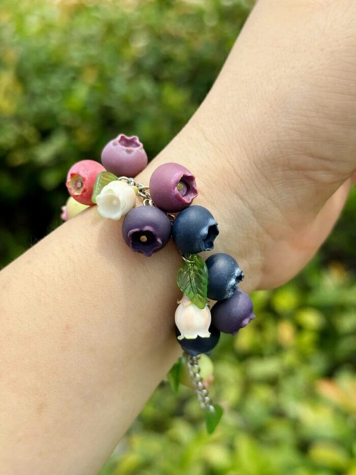 Close-up of realistic blueberry charm bracelet quirky handmade jewelry