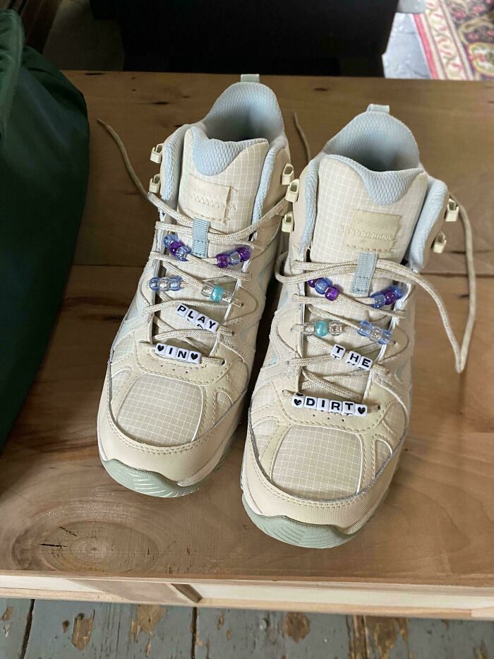 Beige sneakers decorated with beads and letter charms quirky accessories