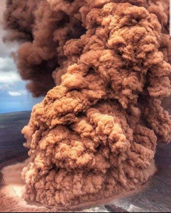 Massive brown smoke plume rising from the ground. This image is one of the forbidden foods.