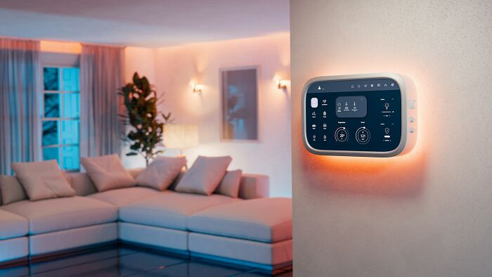 Smart home security panel in a modern living room for women living alone to protect themselves.