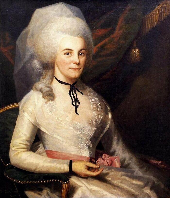 18th-century painting of a woman in a white dress, elaborate wig, and a black choker, representing women in history.