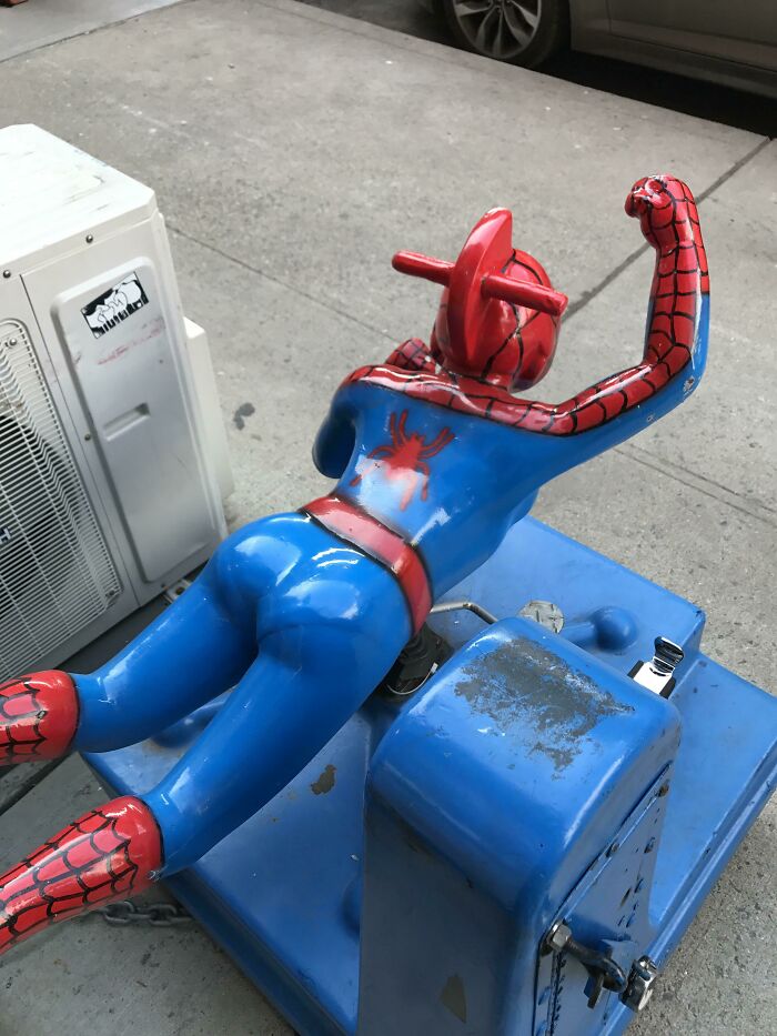 A playground fail of a Spider-Man ride with a broken head, showcasing a humorous, unexpected design.