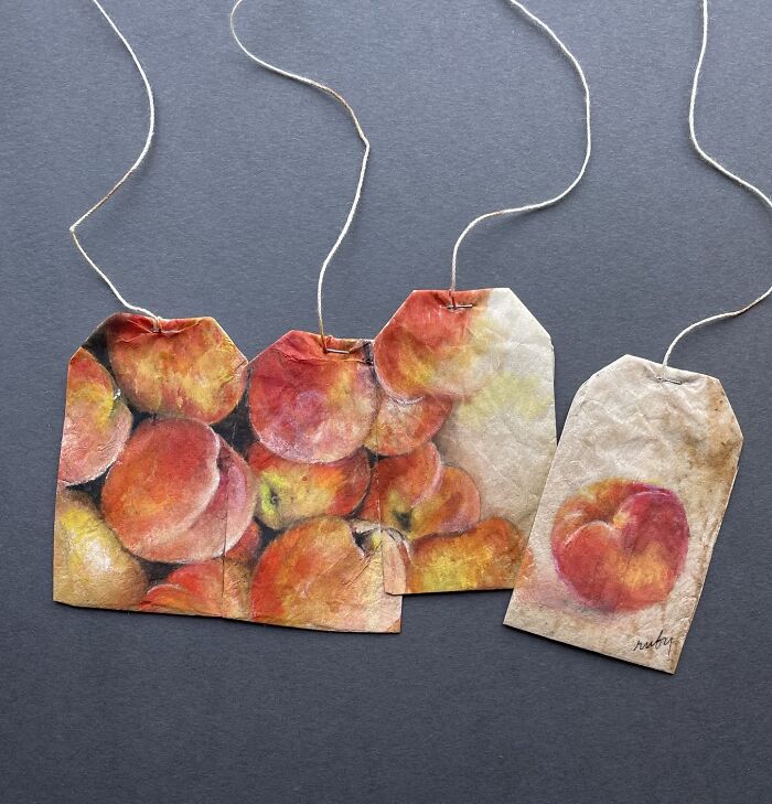 Artist Ruby Silvious miniature paintings of fresh red peaches on four tea bags