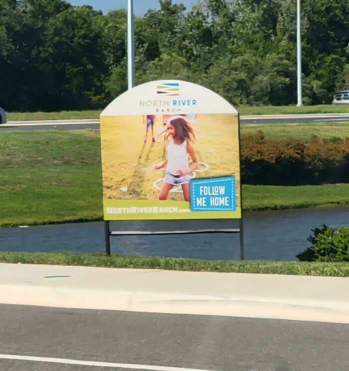 Hilariously unhinged design fails: A billboard with a girl running on a lawn, next to a river.