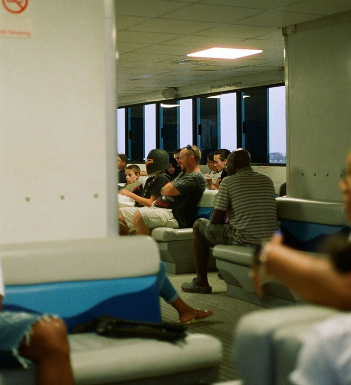 People sitting and conversing in a public waiting area