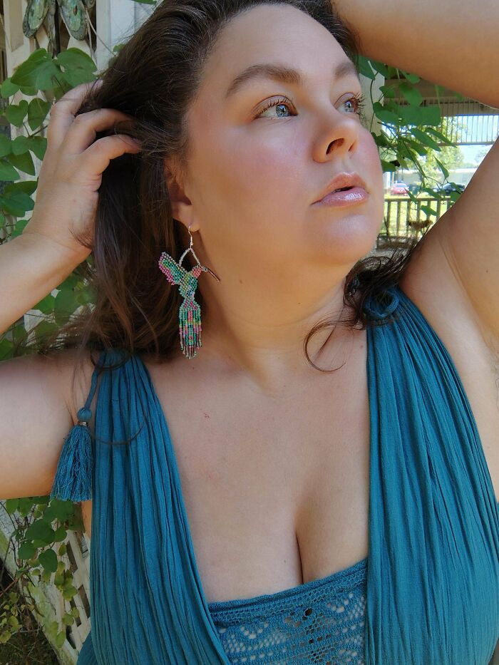 Woman wearing colorful beaded hummingbird earrings, quirky projects jewelry