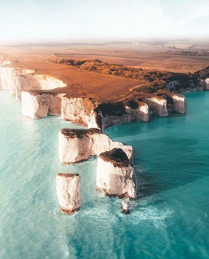 Stunning aerial view of Old Harry Rocks chalk formations rising from the turquoise sea. Forbidden foods.
