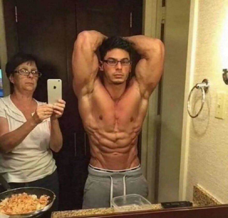 An uncomfortable and chaotic image of a muscular man posing while an older woman takes a photo in a mirror.