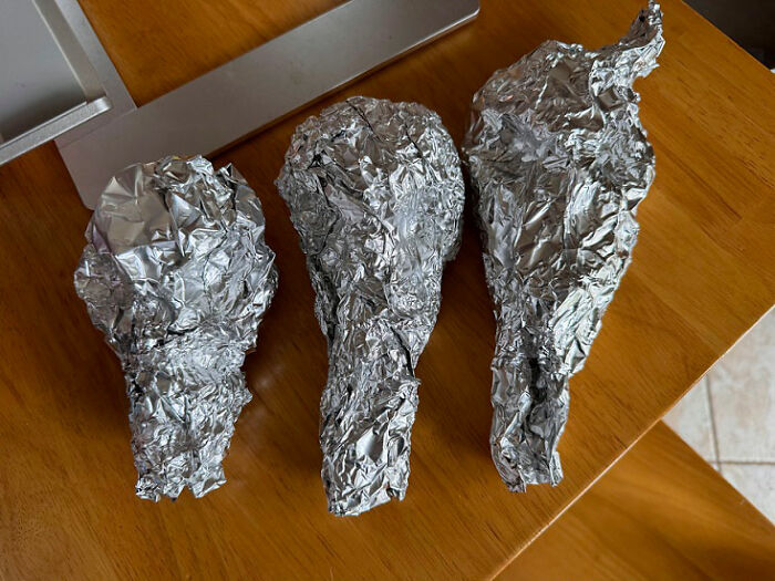Aluminum foil shaped into animal skulls for a Mad Max Furry Road photoshoot prop.