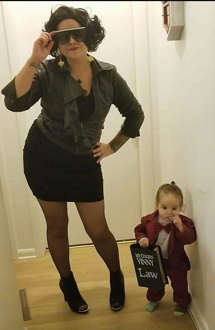 A woman and toddler dressed in My Cousin Vinny themed Halloween costumes.