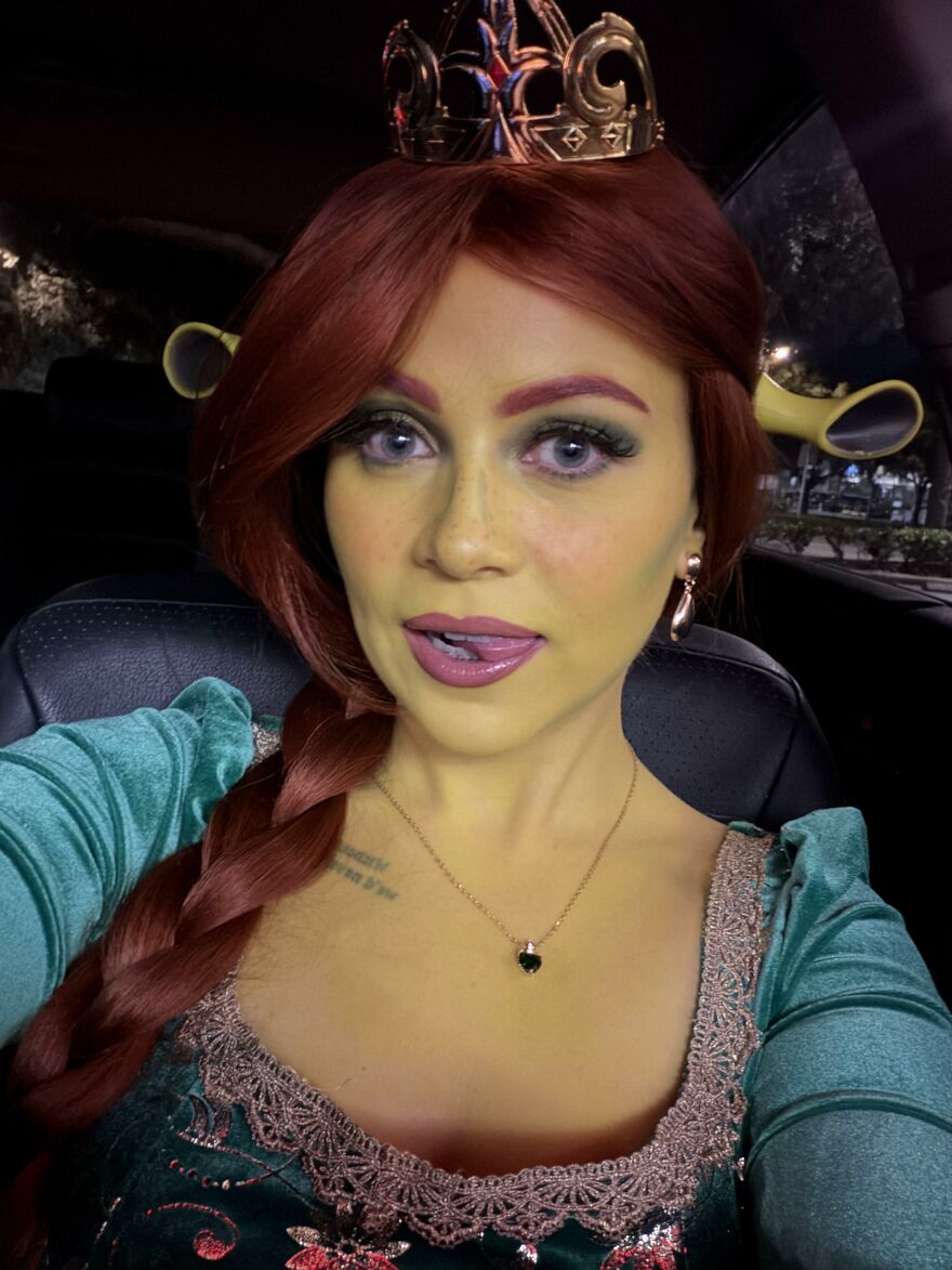 Woman in green face paint dressed as Princess Fiona as creative Halloween costume ideas