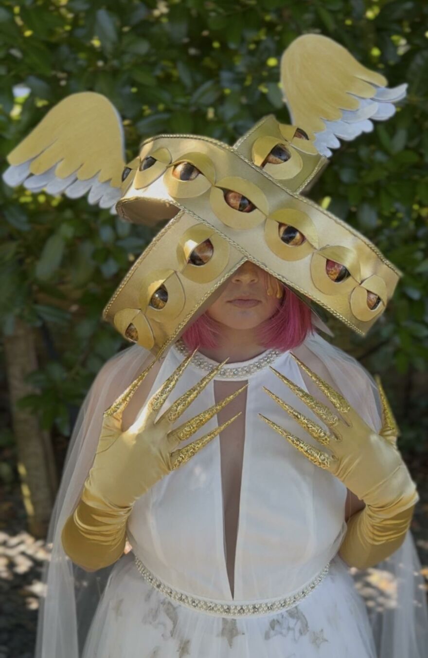 Biblically accurate angel outfit featuring golden eyes and wings as creative Halloween costume ideas.