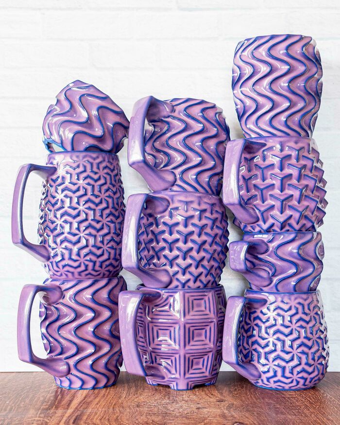 Stack of purple textured ceramic mugs demonstrating creative pottery creations