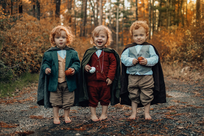Three young kids wearing Hobbit Halloween costumes in woods