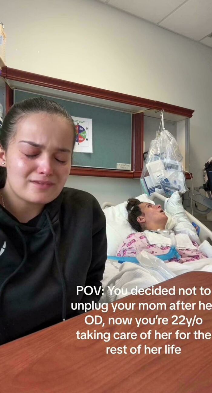An influencer filming content in a hospital room beside a patient for social media.