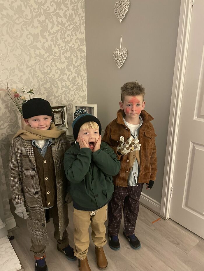 Three kids dressed in Home Alone movie Halloween costumes