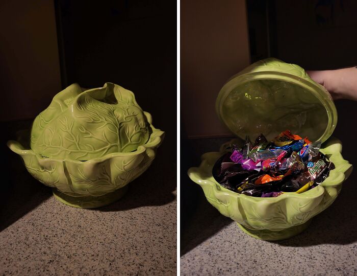 A cabbage-shaped ceramic tureen filled with colorful candies, highlighting creative thrift store finds.
