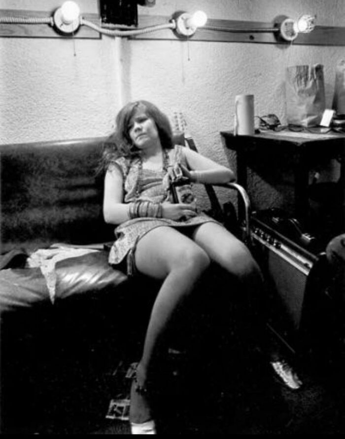 Musician holding a bottle backstage captured in photos for the last time
