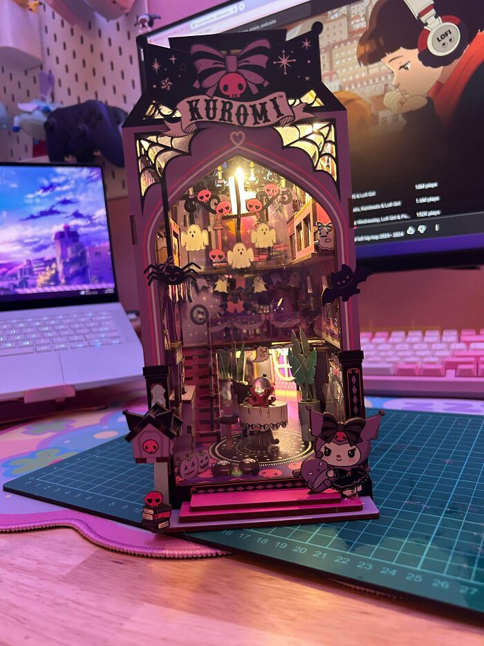 Spooky Kuromi themed miniature book nook kit with pink lights, ghosts, and bats decorations