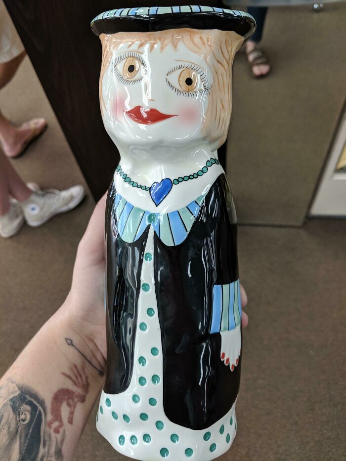 A hand-painted ceramic woman figurine vase, found as a vintage thrift store find.