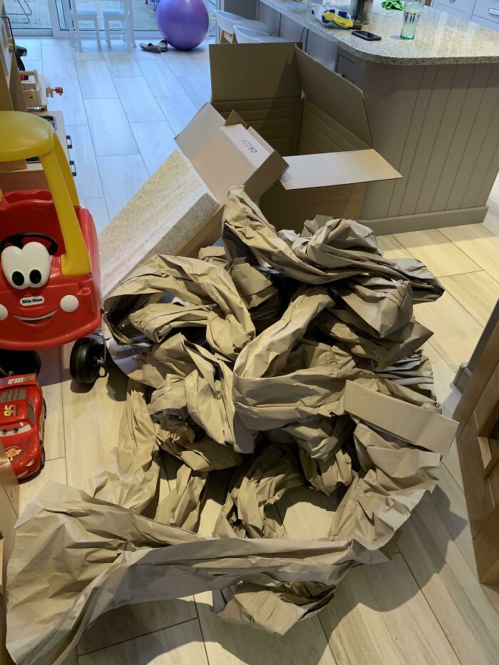 An enormous pile of packing paper from a small box demonstrating packaging fails.