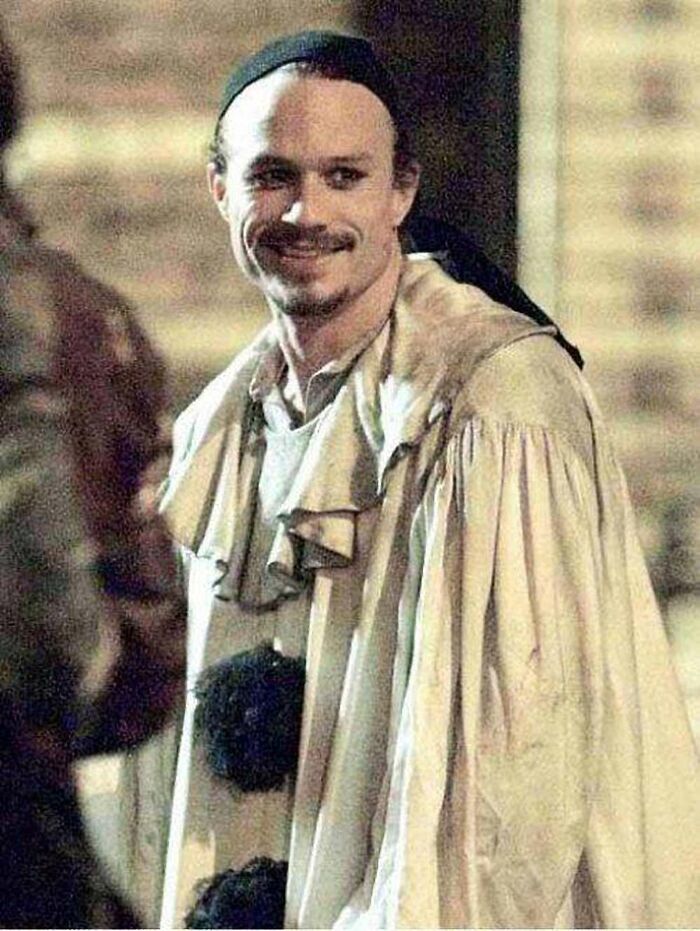 Heath Ledger in costume smiling, captured in photos for the last time.