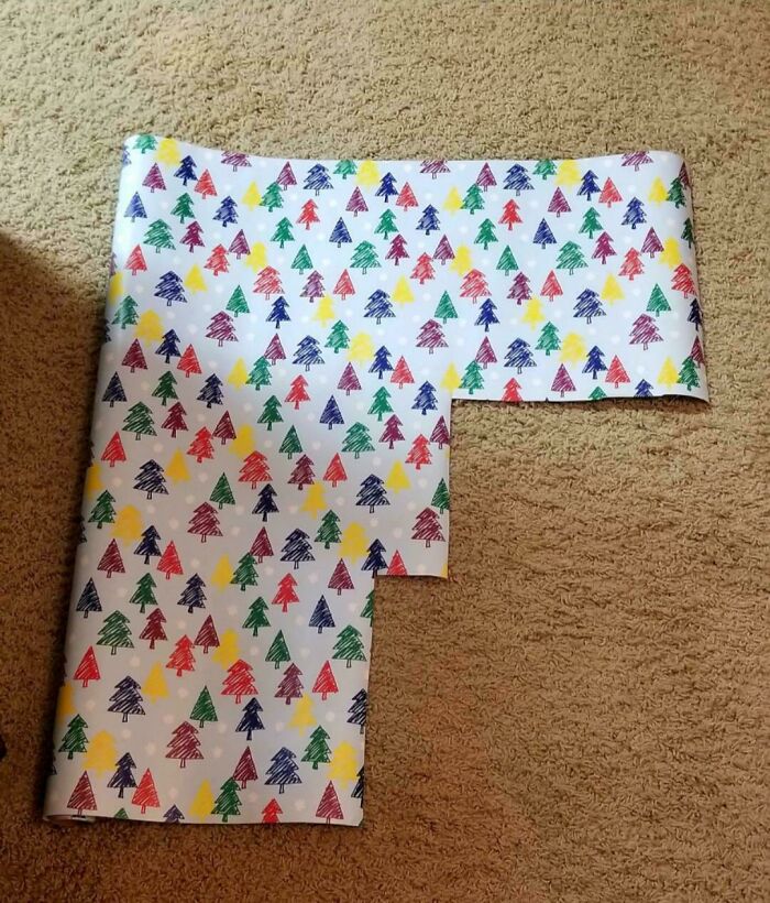 Wrapping paper cut in a strange stair-step shape, showcasing husbands' funniest quirks.