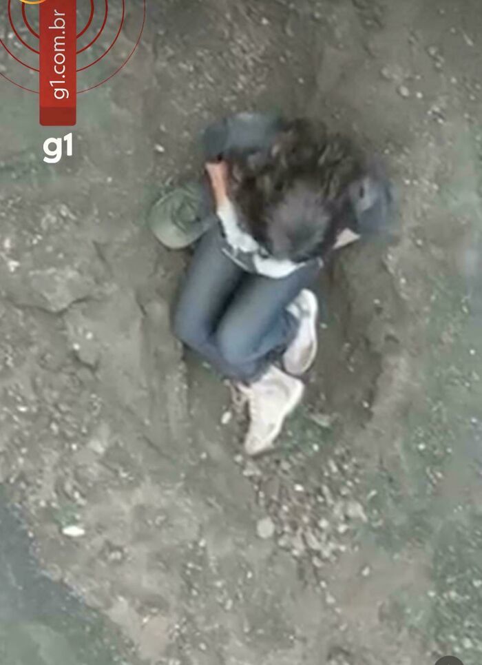 Overhead view of a person captured in photos for the last time sitting on dusty ground.