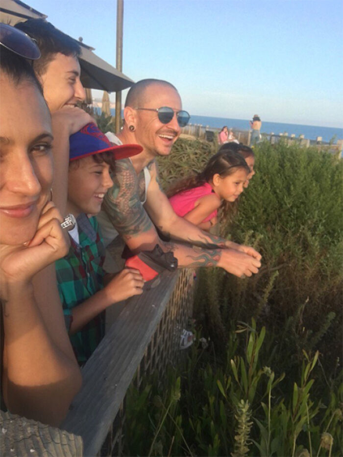 Chester Bennington smiling with family, captured in photos for the last time.