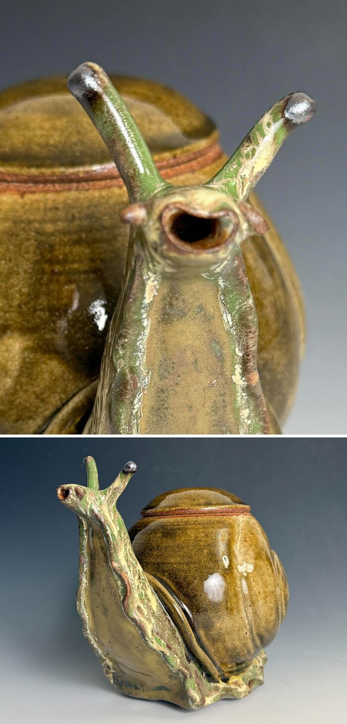 A unique glazed ceramic teapot shaped like a detailed snail, displaying creative pottery creations.